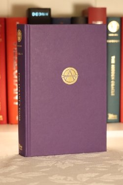 A purple hardcover book with a gold symbol in the center with an 'A'.